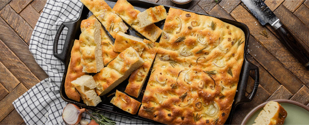 Focaccia served in pan on table