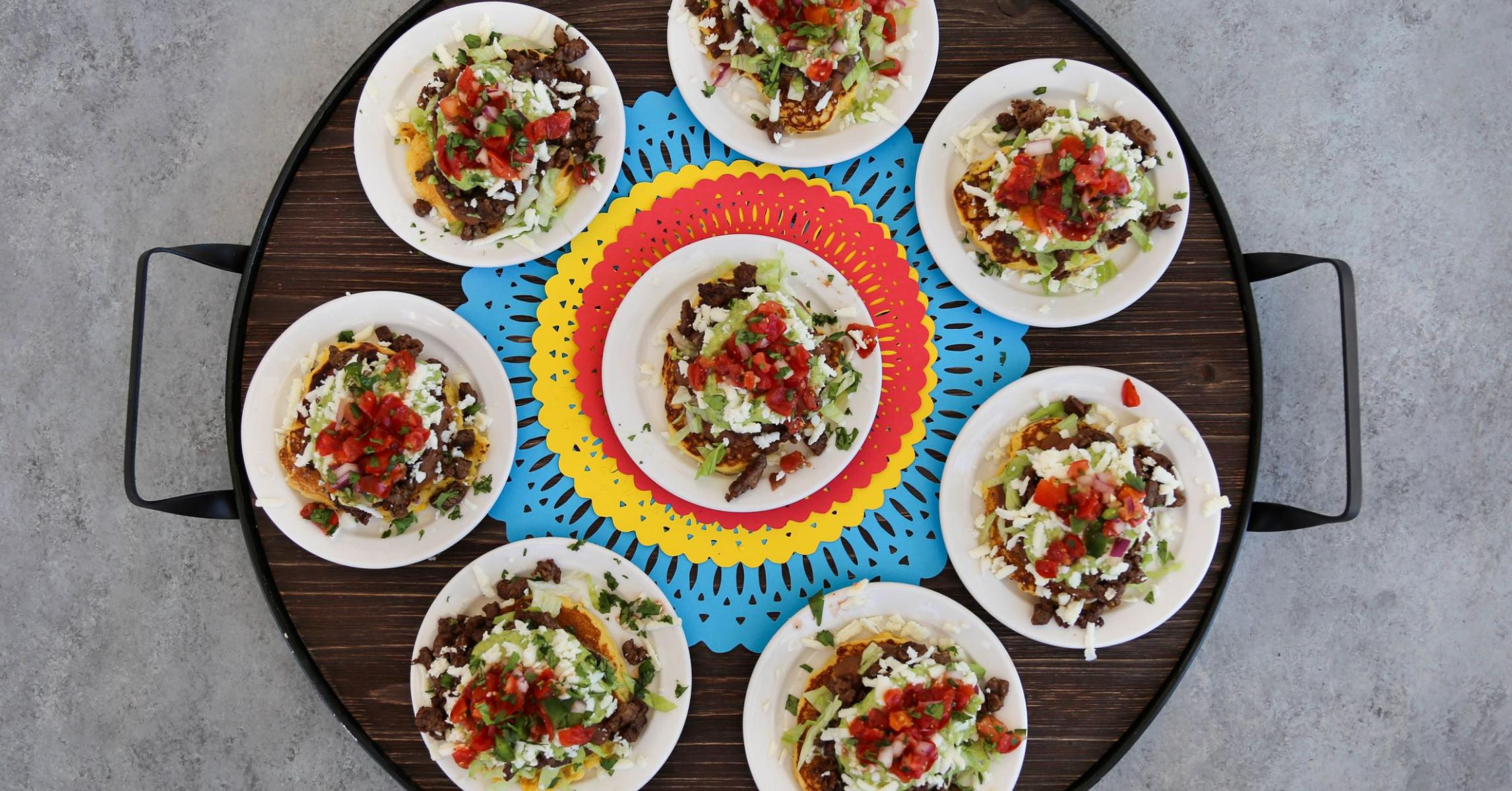 Mexican Corn Cakes With Charred Corn, Carne Asada, Refried Beans and Guasacaca (Avocado) Sauce