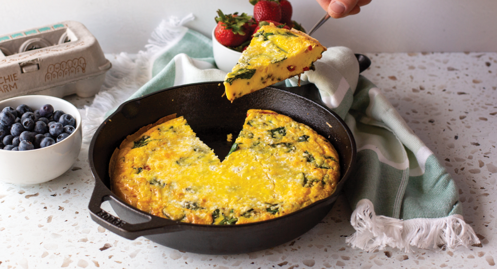 Goat cheese frittata being served from skillet