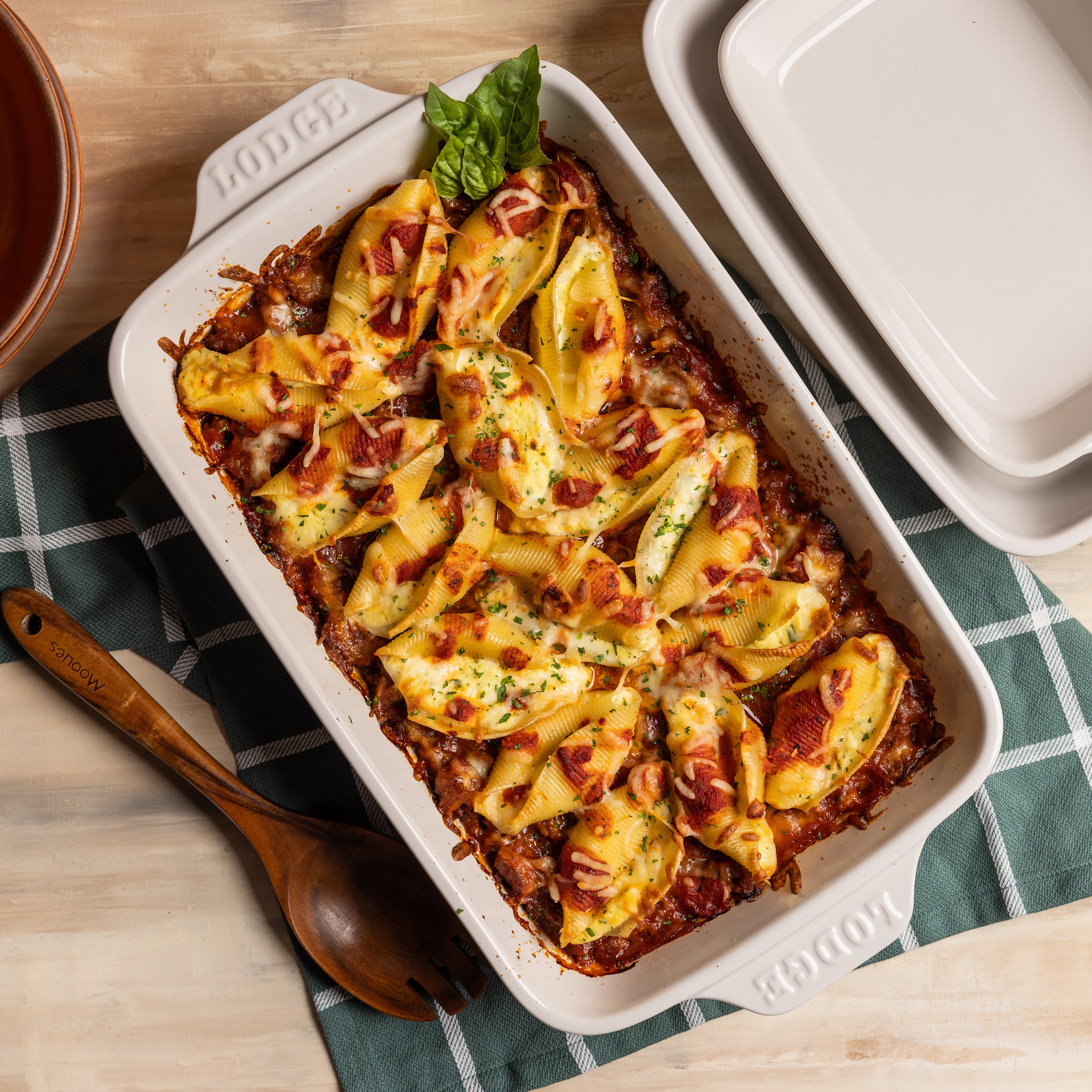 Freshly baked pasta in rectangular stoneware baking dish.