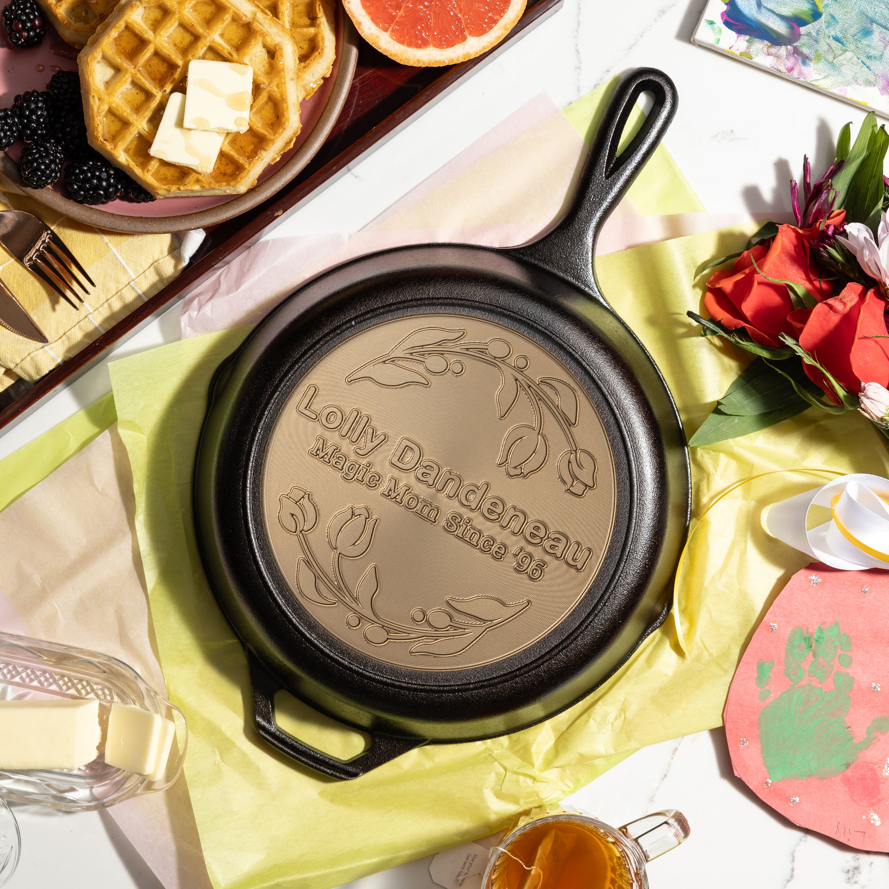 Custom engraved tulip skillet presented on table with gift paper and decor.