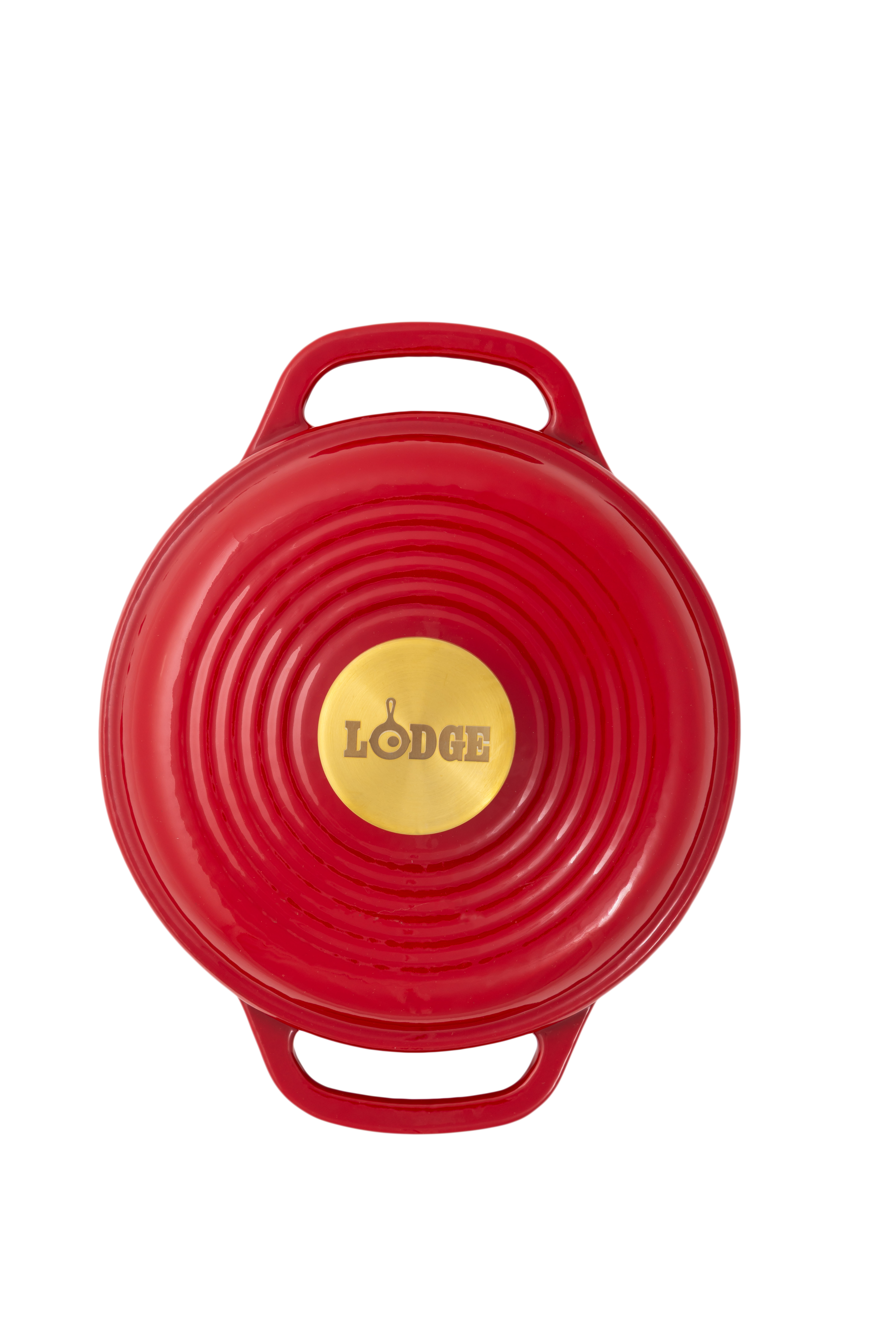 A red Lodge cast iron Dutch oven shown from a top-down view, featuring a circular lid with concentric ridges, two side handles, and a gold-colored center knob with the Lodge logo.