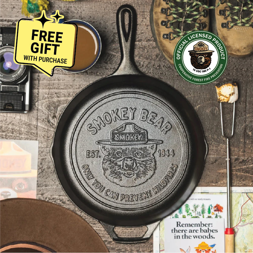 Cast iron skillet with officially licensed Smokey Bear logo, with a badge saying "Free Gift with Purchase".