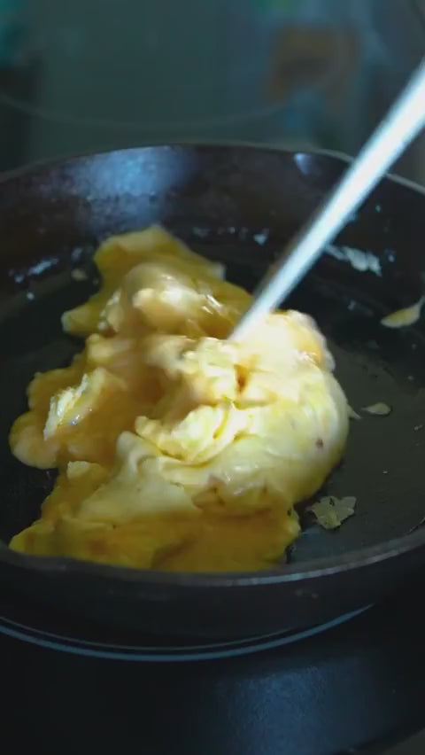 Load video: How to Make Scrambled Eggs in Cast Iron Lodge Cast Iron