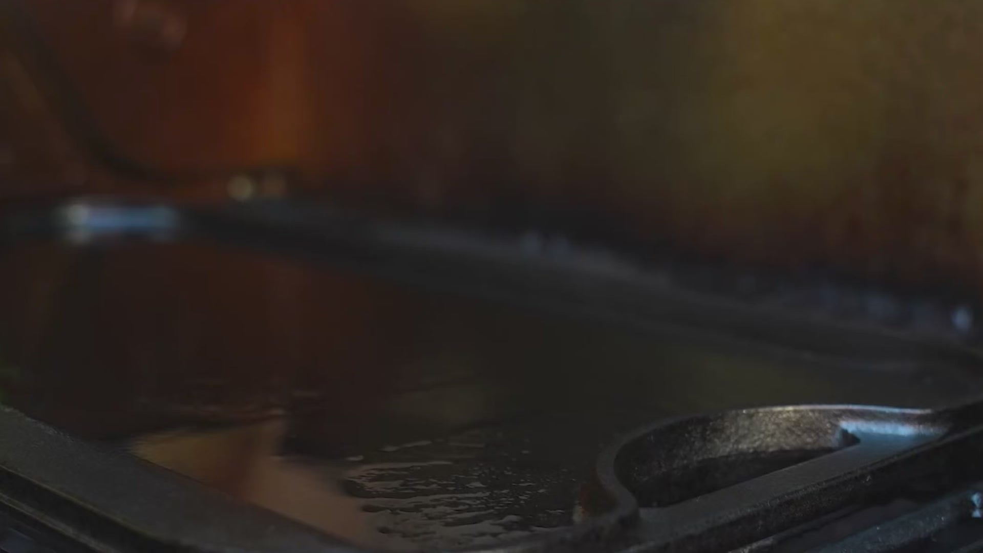 Load video: cast iron griddle on flaming grill