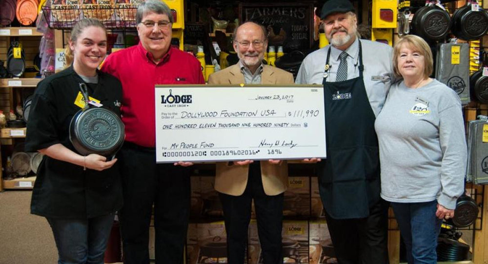 Lodge representatives holding large donation check