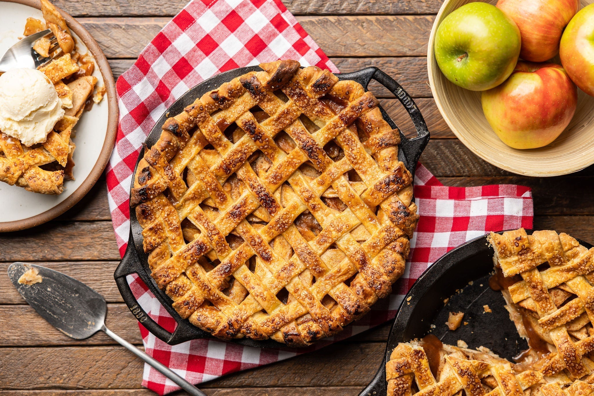 A lattice apple pie on a gingham napkin