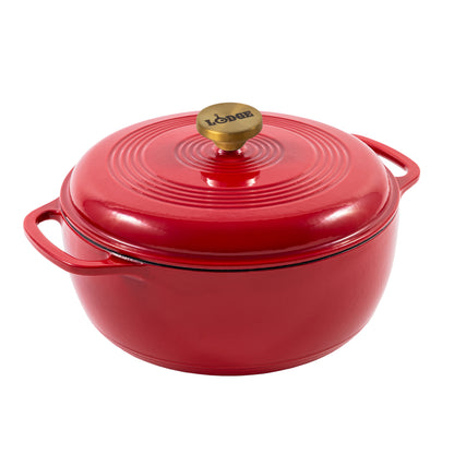 Ruby red enameled cast iron Dutch oven including a lid with gold knob.