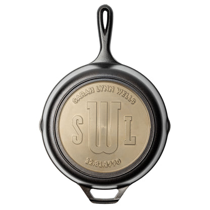 Custom cast iron skillet with editable text engraved along the top curve, center, and bottom curve.