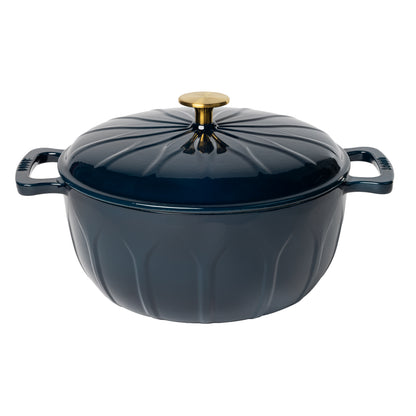 A dark navy blue enameled cast iron pot with a matching lid, featuring a ribbed pumpkin-like design, side handles, and a gold-toned knob.