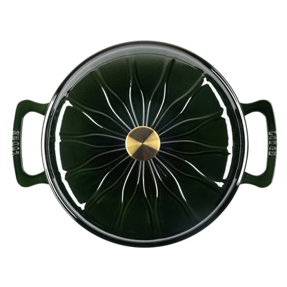 Top down view of enameled cast iron pot with a matching lid, featuring a central gold knob and white radial lines on the lid.