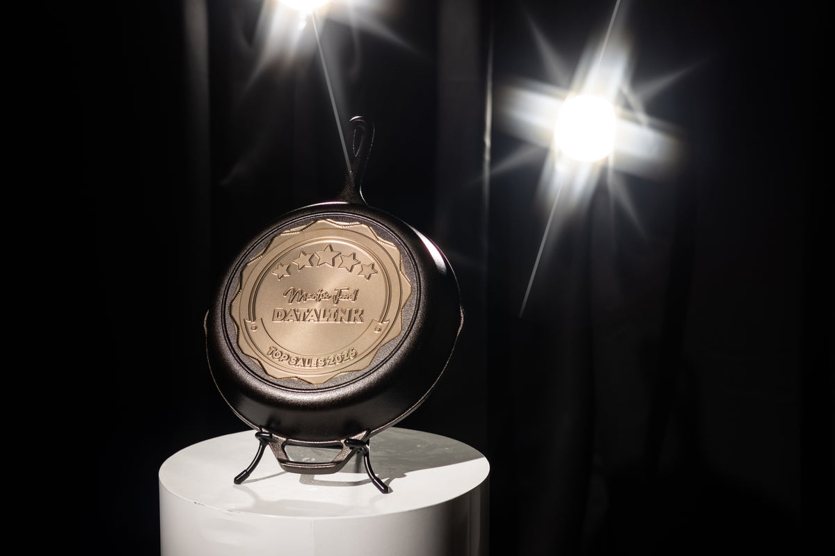 Decorative item on a white pedestal with bright lights in the background