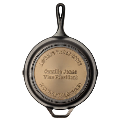 Engraved skillet with personalized congratulatory text for the recipient.