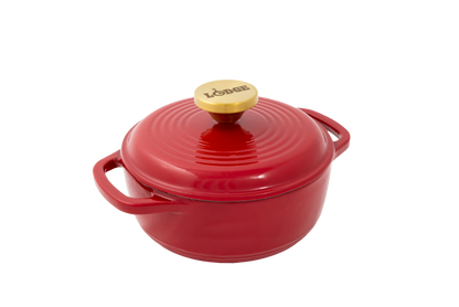 Ruby red enameled cast iron Dutch oven including a lid with gold knob.