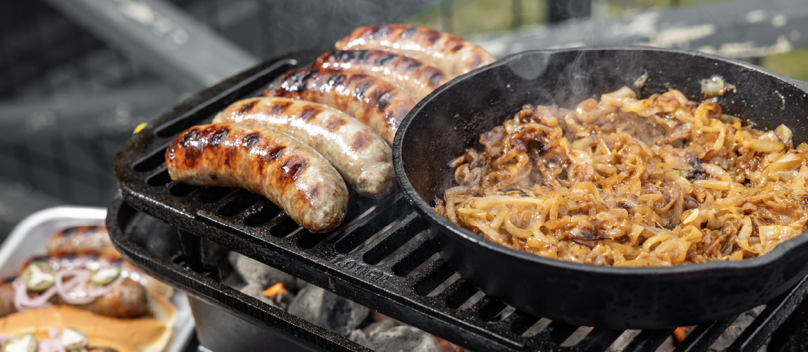 Beer brat's cooking on cast iron Sportsman's Pro grill.