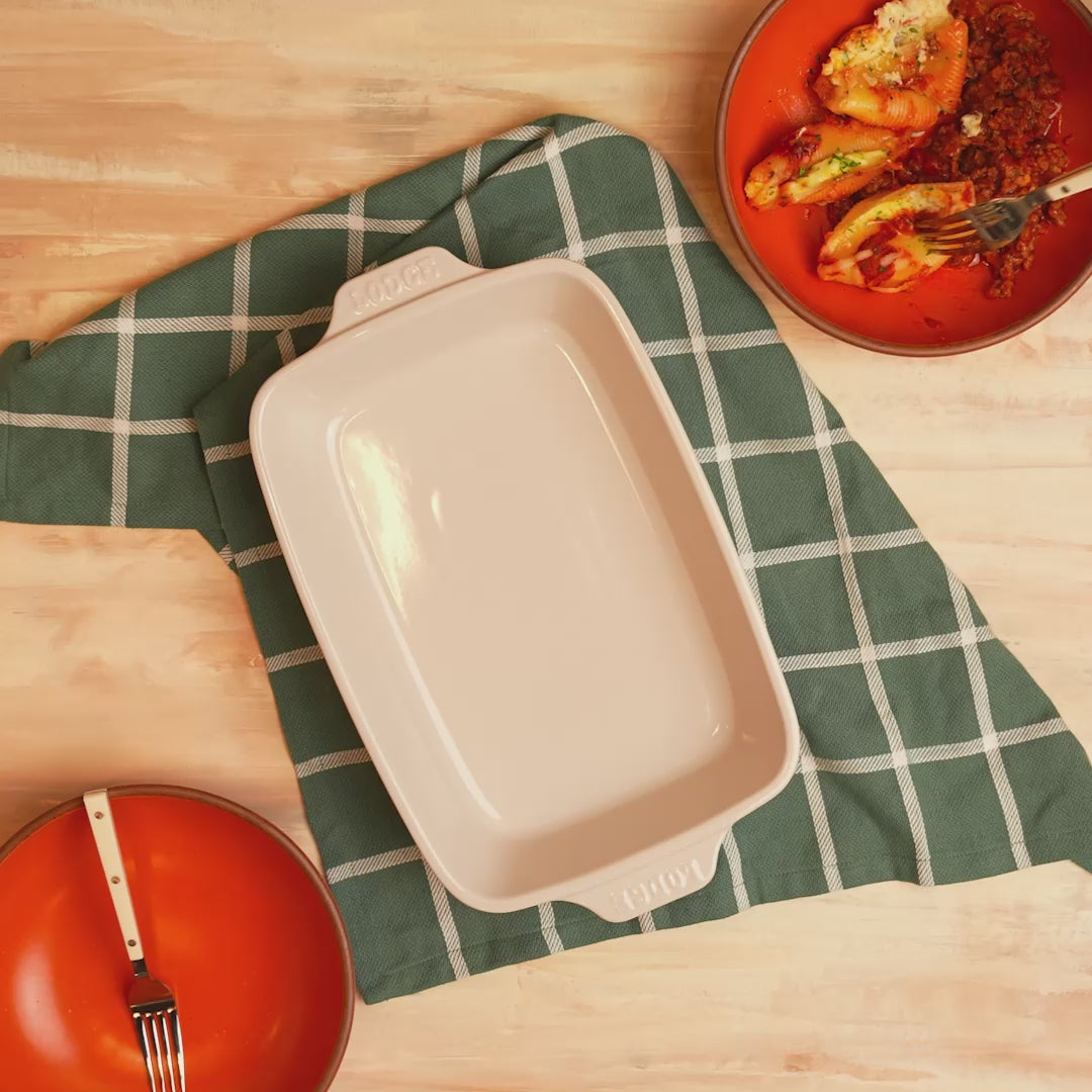 Fresh, baked pasta served beside oyster-casserole dish.
