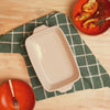 Fresh, baked pasta served beside oyster-casserole dish.