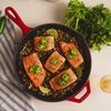 Close up video of freshly prepared salmon, made and served in skillet.