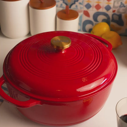 Someone removing lid of dutch oven revealing freshly prepared chicken.