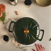 Close-up view of braiser sunburst design.