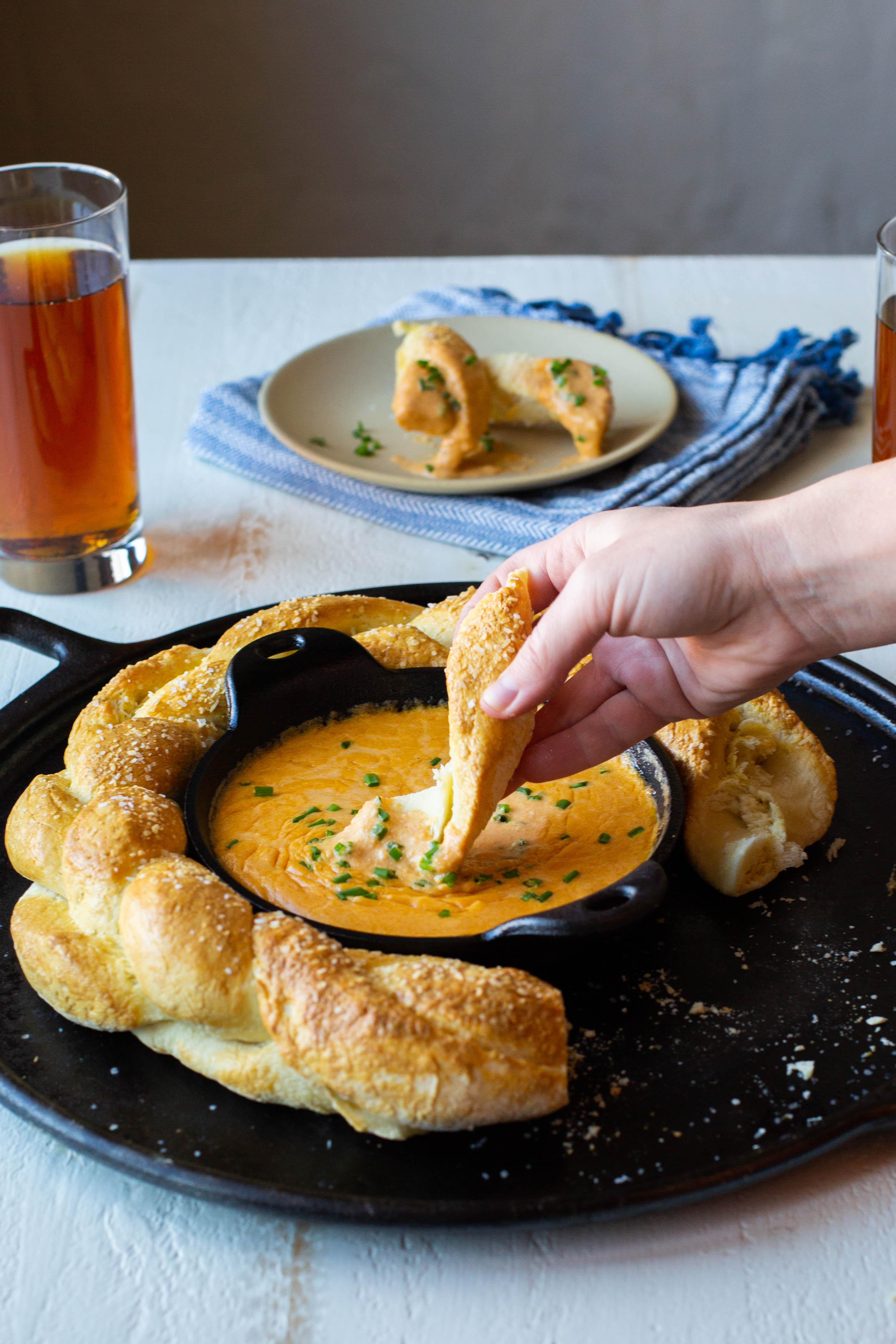 Beer cheese dip made in a Lodge heat-treated cast iron round mini server