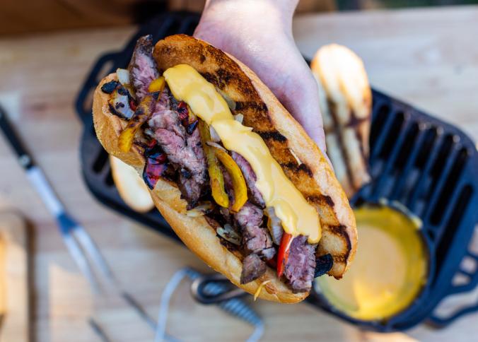https://www.lodgecastiron.com/sites/default/files/styles/view_slider__tombras_extra_small_2x/public/2022-05/Grilled%20Cheesesteaks.png?h=065cefcd&itok=DXhyNdjQ
